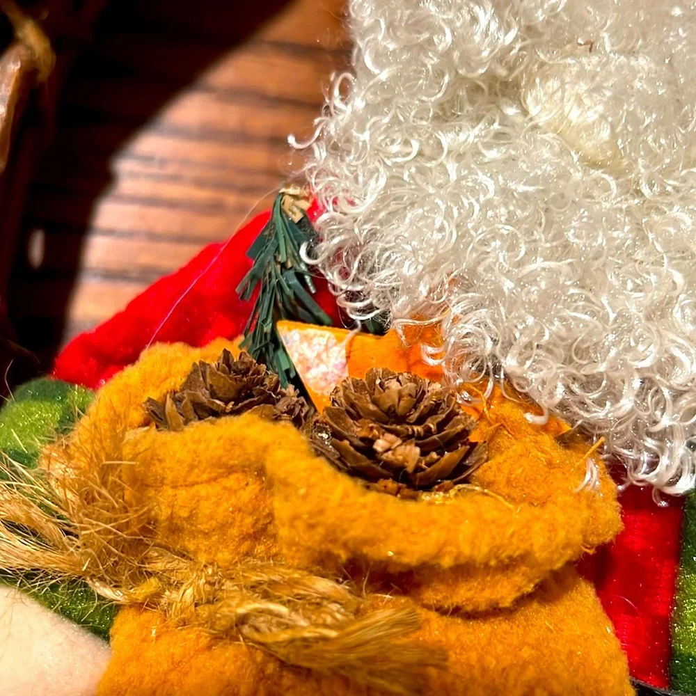 Festive. Merry Christmas. Sitting Santa Claus on the Wooden Bench.